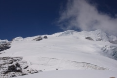 View from Base Camp towards the summit. High Camp is just beyond the rocky outcrop centre picture.