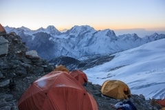 Peeking out of the tent at High Camp at sunrise