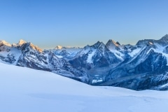 The early sun on the surrounding peaks from high camp.