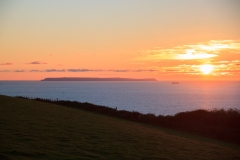 Lundy Island in the setting sun seen from Saunton Down