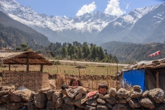Children and the runway at Lukla with the Zatwa La (pass) in the background.