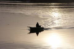 Fisherman in Boat in the Taw Estuary