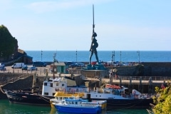 August: "Verity" sculptor by Damian Hurst on Ilfracombe Harbour